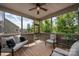 Relaxing screened porch with comfortable seating and views of the lush surroundings at 1805 Trading Path Ln, Waxhaw, NC 28173