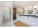 Modern bathroom featuring double vanity, tiled walk-in shower, and stylish fixtures at 1830 Commodore St, Charlotte, NC 28205