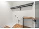 This laundry room is equiped with a countertop and rack space at 1830 Commodore St, Charlotte, NC 28205