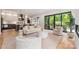 Spacious living area with hardwood floors, modern furniture, and a seamless connection to the kitchen at 1830 Commodore St, Charlotte, NC 28205
