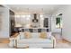 Open-concept living space with a modern kitchen, white sofa, and neutral decor at 1830 Commodore St, Charlotte, NC 28205