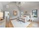 Bright main bedroom with vaulted ceiling, hardwood floors, and neutral decor at 1830 Commodore St, Charlotte, NC 28205