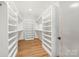 Walk-in closet with built-in shelving and ample storage at 1830 Commodore St, Charlotte, NC 28205