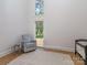 Bright room featuring hardwood floors, a view of the yard, and a seating area at 202 Walden Ln, Weddington, NC 28104