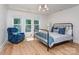 Bedroom with a queen bed, chair, and hardwood floor at 202 Walden Ln, Weddington, NC 28104