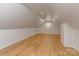 Finished bonus room features wood flooring, natural light from window and neutral walls at 202 Walden Ln, Weddington, NC 28104