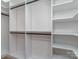 Walk-in closet features custom shelving and hanging racks at 202 Walden Ln, Weddington, NC 28104