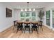 Dining room with modern light fixture and outdoor views at 202 Walden Ln, Weddington, NC 28104