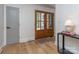 Inviting entryway featuring hardwood floors, wood-framed double doors, and stylish decor at 202 Walden Ln, Weddington, NC 28104