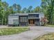 Modern home exterior with a well-manicured lawn and unique architectural design at 202 Walden Ln, Weddington, NC 28104
