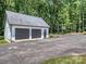 Detached two car garage with basketball hoop and plenty of paved parking space at 202 Walden Ln, Weddington, NC 28104