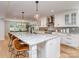 Gourmet kitchen features a large island, granite countertops, and state-of-the-art stainless steel appliances at 202 Walden Ln, Weddington, NC 28104