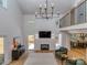 Open living room with fireplace, high ceilings and backyard access at 202 Walden Ln, Weddington, NC 28104