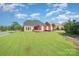 Large backyard featuring green grass, a pergola, and views of neighboring homes at 2100 Goddard Way, Waxhaw, NC 28173