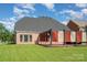 Spacious backyard with a pergola, lush green lawn, and brick accents at 2100 Goddard Way, Waxhaw, NC 28173