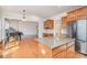 Open kitchen featuring wooden cabinetry, stainless steel appliances, and granite countertops at 2100 Goddard Way, Waxhaw, NC 28173