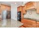 Close-up showcasing granite countertops, wooden cabinets, and stainless steel appliances in this home's kitchen at 2100 Goddard Way, Waxhaw, NC 28173