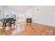 Spacious living room boasting a fireplace, grand piano, hardwood floors, and plenty of natural light at 2100 Goddard Way, Waxhaw, NC 28173
