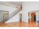 Bright open floor plan features a grand staircase, hardwood floors and seamless flow into the adjacent kitchen at 2100 Goddard Way, Waxhaw, NC 28173