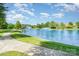 Scenic community pond with fountains, walking path and green space at 2100 Goddard Way, Waxhaw, NC 28173