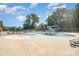 Community pool area with a pool, waterslide and lounge chairs under a bright blue sky at 2100 Goddard Way, Waxhaw, NC 28173