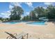 Community pool with a lap area, area, and multiple lounge chairs at 2100 Goddard Way, Waxhaw, NC 28173
