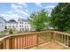 Enjoy the view from this light-wood balcony, ideal for relaxing outdoors in a modern community at 216 Mattoon St, Charlotte, NC 28216