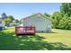 Exterior view of house highlighting a wooden deck on a grassy lawn at 219 E Boston Ave # 141516, Bessemer City, NC 28016