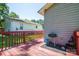 Exterior side view of house and deck featuring a grill and storage at 219 E Boston Ave # 141516, Bessemer City, NC 28016