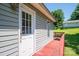 Side exterior showcasing the deck, back door, and well-maintained siding of the house at 219 E Boston Ave # 141516, Bessemer City, NC 28016