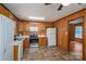 Cozy kitchen with wood cabinets, tile flooring, and stainless steel appliances at 219 E Boston Ave # 141516, Bessemer City, NC 28016