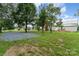 Charming home featuring a lush backyard, patio, and gravel area, perfect for outdoor relaxation and entertainment at 220 Low Water Bridge Rd, Troy, NC 27371