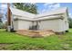 Backyard exterior featuring a new deck, white siding, and grassy yard at 220 Low Water Bridge Rd, Troy, NC 27371