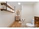 Bathroom featuring single vanity, open shelving, and tiled floors at 220 Low Water Bridge Rd, Troy, NC 27371