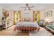 Bright bedroom with hardwood floors, ceiling fan, and inviting decor at 220 Low Water Bridge Rd, Troy, NC 27371