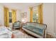 Bedroom featuring natural light, floral curtains, and a sitting area at 220 Low Water Bridge Rd, Troy, NC 27371