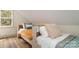 Bedroom featuring two beds, natural light, wood floors and neutral decor at 220 Low Water Bridge Rd, Troy, NC 27371