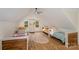 Cozy bedroom featuring two beds, wood floors, natural light and neutral decor at 220 Low Water Bridge Rd, Troy, NC 27371