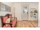 Elegant foyer with hardwood floors, an antique bench, and tasteful decor, creating a warm welcome at 220 Low Water Bridge Rd, Troy, NC 27371