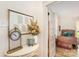 Charming hallway with decor leading to bedroom; features wood floors and white trim at 220 Low Water Bridge Rd, Troy, NC 27371