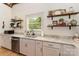 Kitchen features stainless steel appliances, open shelves, and natural light at 220 Low Water Bridge Rd, Troy, NC 27371