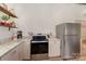 Kitchen with stainless appliances, granite countertops, and wood accents at 220 Low Water Bridge Rd, Troy, NC 27371