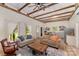 Open-concept layout of living room, with exposed beams and kitchen at 220 Low Water Bridge Rd, Troy, NC 27371