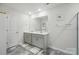 Bright bathroom showcasing double sinks, a large mirror, and modern fixtures for a spa-like experience at 2282 Redstone Dr, York, SC 29745