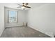 Bedroom featuring neutral walls, soft carpet, and a sun-filled window with attractive blinds at 2282 Redstone Dr, York, SC 29745