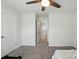 Neutral bedroom with gray carpet, ceiling fan, and white doors ready for your personal touch at 2282 Redstone Dr, York, SC 29745