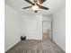 Bedroom features a ceiling fan, neutral walls, gray carpet, and a closet space at 2282 Redstone Dr, York, SC 29745