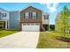 Charming two-story home with a two-car garage and a well-maintained front yard at 2282 Redstone Dr, York, SC 29745