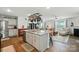 Open-concept kitchen with an island, granite countertops, stainless steel appliances, and pot rack at 2282 Redstone Dr, York, SC 29745
