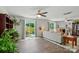 Bright living room featuring wood floors, ceiling fan, fireplace, and sliding glass door to the outdoor patio at 2282 Redstone Dr, York, SC 29745